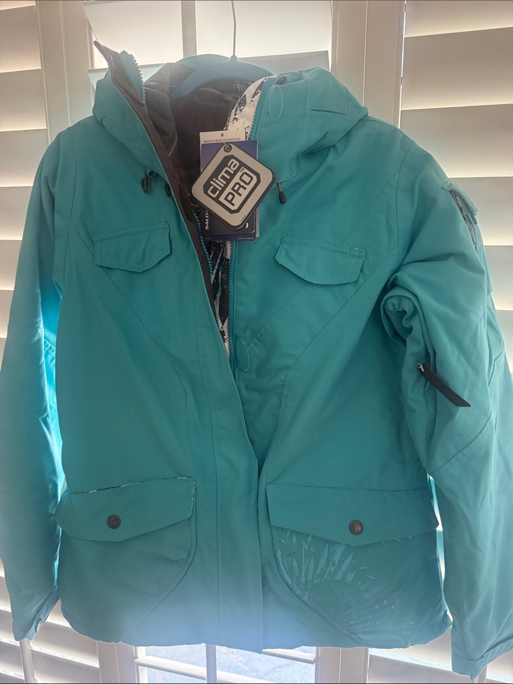 Teal Hooded Puffer Jacket by Salomon